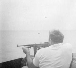 hemingway_and_his_m1921_tommy_gun_going_after_some_grey_suits.jpg